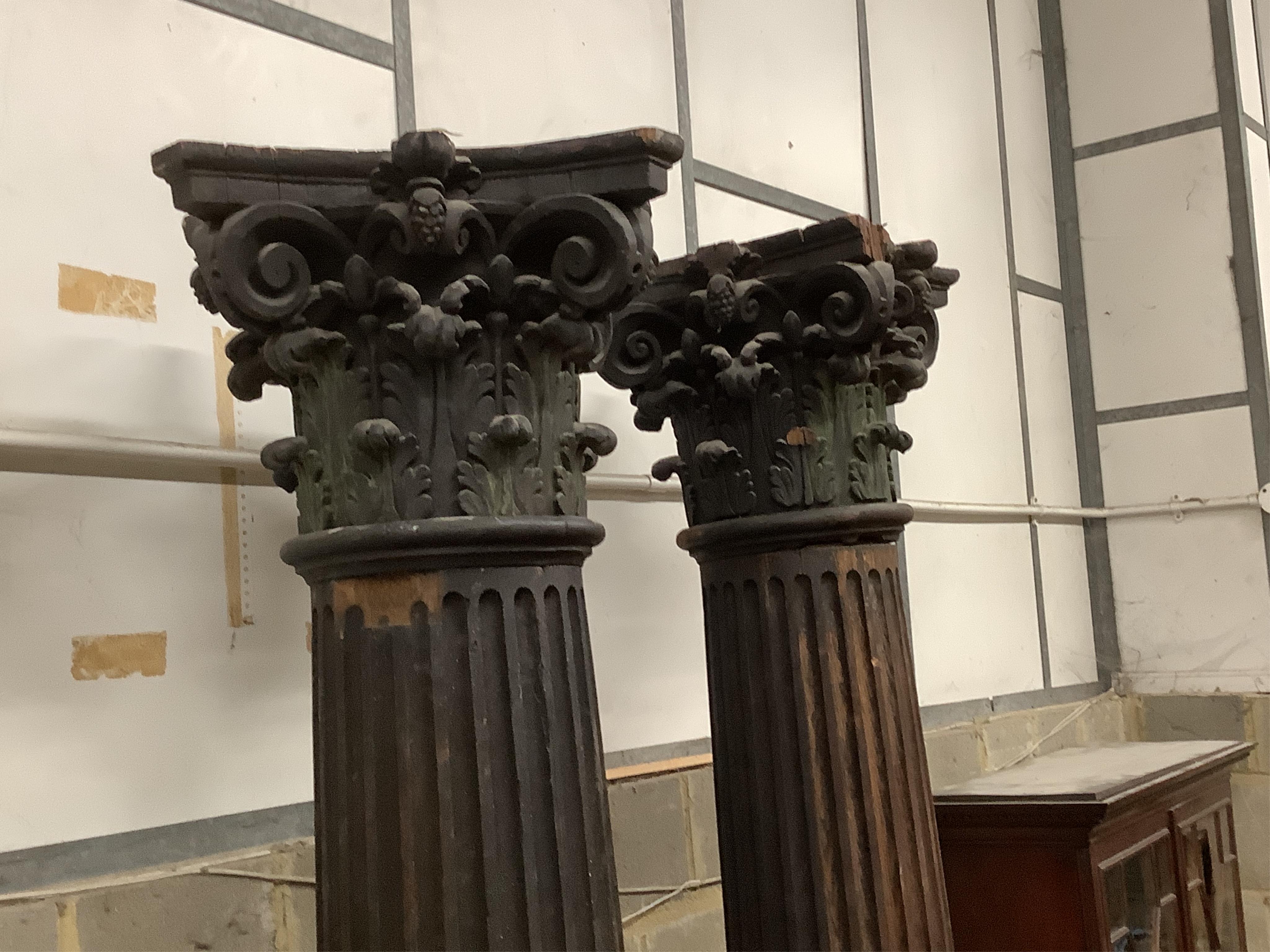 A pair of 17th century oak Corinthian columns, of large size, height 279cm, by repute from St Mary le Bow, designed by Christopher Wren